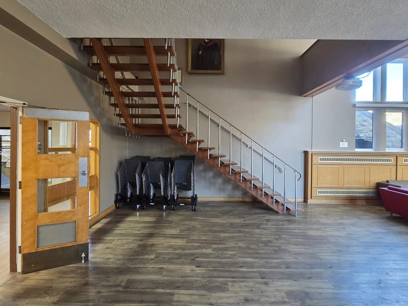 Hall entrance with staircase and hardwood floors