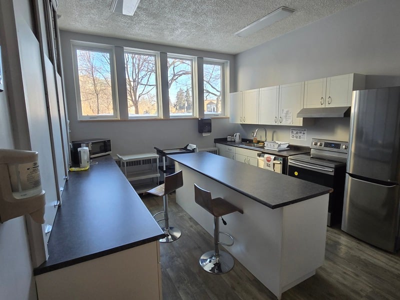Kitchen with bar seating and prep counters